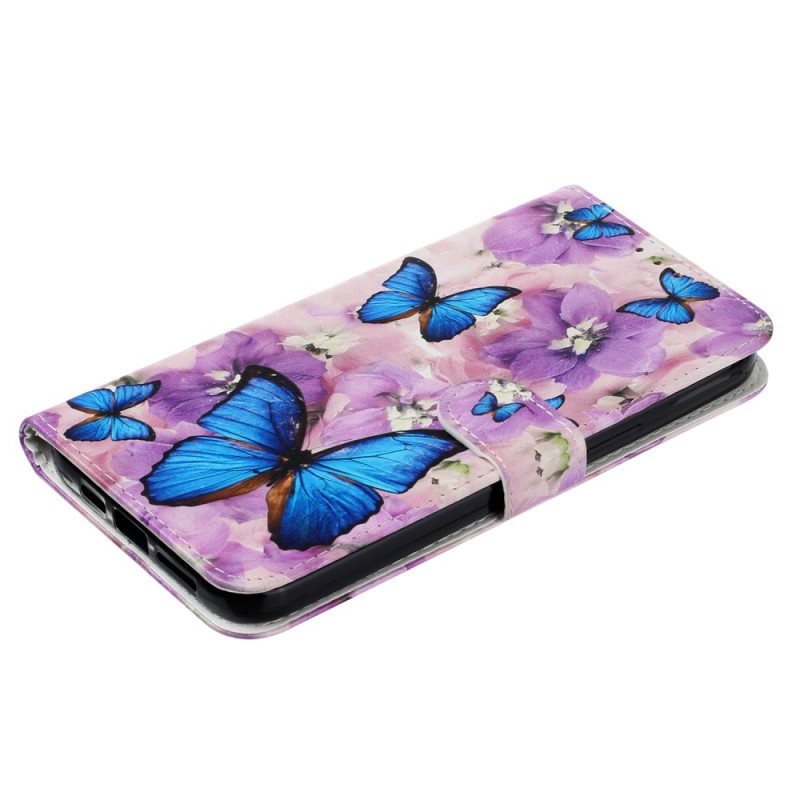 Folio Deksel iPhone 16 Pro Max Sommerfugler Og Lilla Blomster Med Stropp